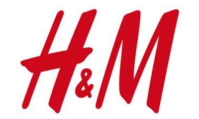 Text of "H & M" in right-leaning, capitalized, red font
